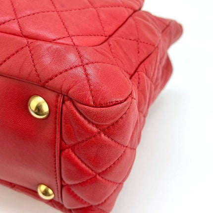 Sac cabas Chanel Grand Shopping Tote en cuir caviar bordeaux, taille GM, finitions argentées