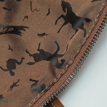Sac de voyage Longchamp Au Sultan en cuir marron avec poignée et bandoulière en toile