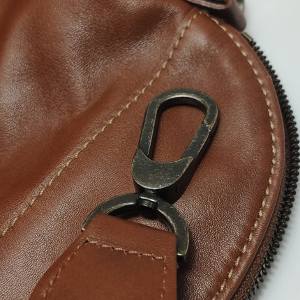 Sac de voyage Longchamp Au Sultan en cuir marron avec poignée et bandoulière en toile