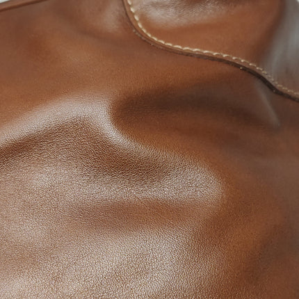 Sac de voyage Longchamp Au Sultan en cuir marron avec poignée et bandoulière en toile