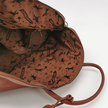 Sac de voyage Longchamp Au Sultan en cuir marron avec poignée et bandoulière en toile