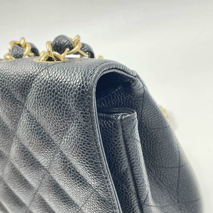 Sold Chanel Classic Flap 2009 Jumbo Black Caviar Leather Single Flap with Gold Hardware