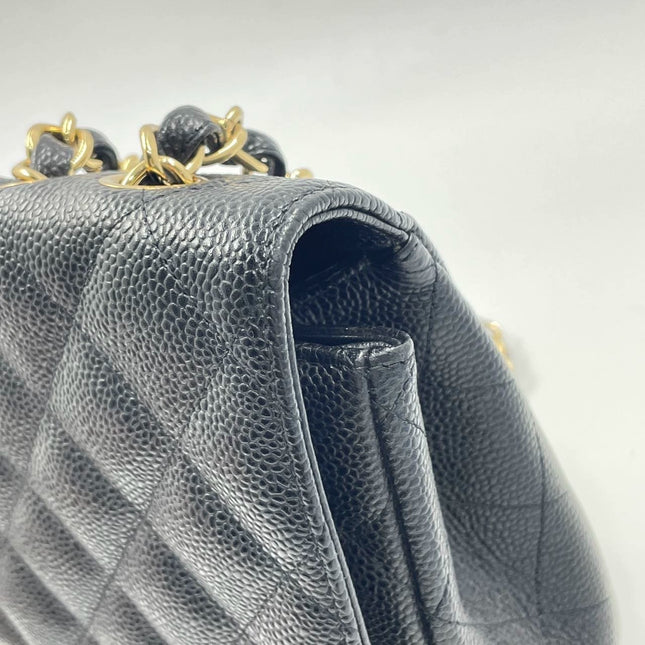 Sold Chanel Classic Flap 2009 Jumbo Black Caviar Leather Single Flap with Gold Hardware