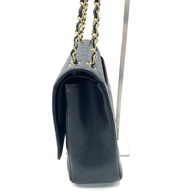 Sold Chanel Classic Flap Maxi Black Caviar Leather Double Flap with Gold Hardware, 2014-2015