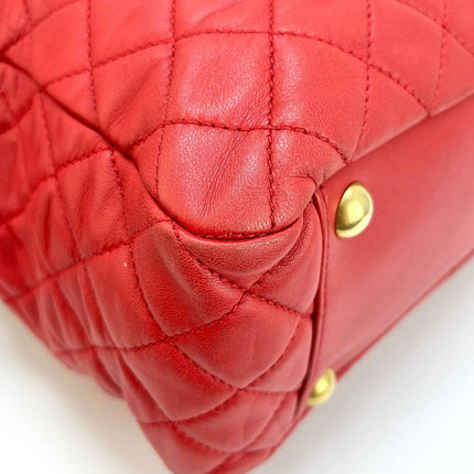 Sac cabas Chanel Grand Shopping Tote en cuir caviar bordeaux, taille GM, finitions argentées