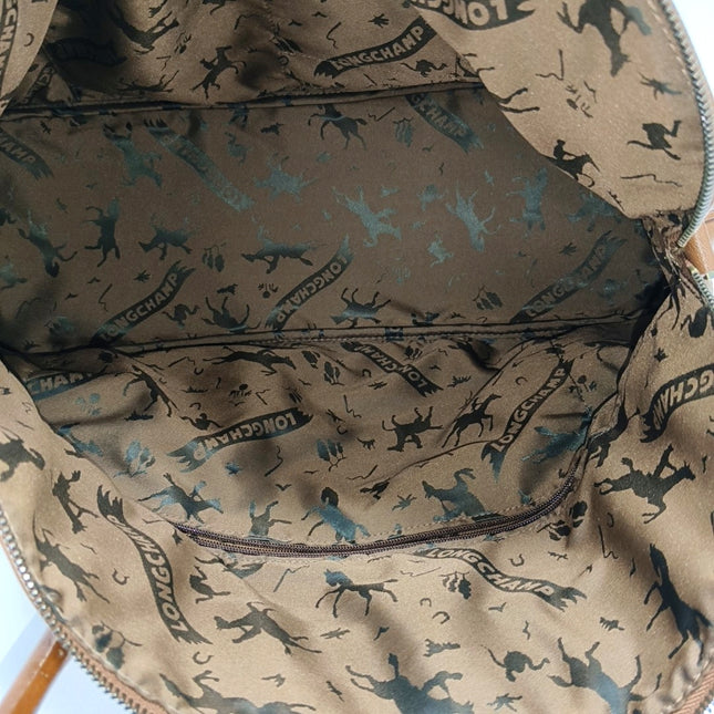 Sac de voyage Longchamp Au Sultan en cuir marron avec poignée et bandoulière en toile