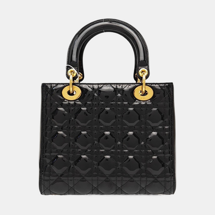 Sac à main Lady Dior moyen en cuir verni noir avec quincaillerie dorée vendu