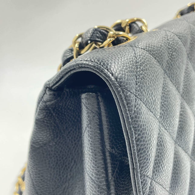 Sold Chanel Classic Flap 2009 Jumbo Black Caviar Leather Single Flap with Gold Hardware