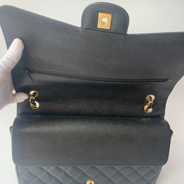 Sold Chanel Classic Flap Maxi Black Caviar Leather Double Flap with Gold Hardware, 2014-2015