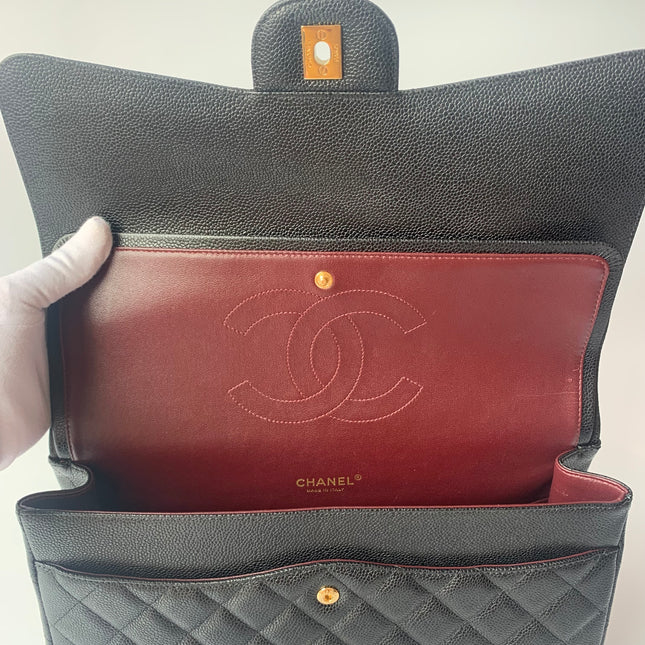 Sold Chanel Classic Flap Maxi Black Caviar Leather Double Flap with Gold Hardware, 2014-2015