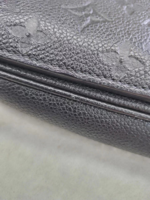 Sold Louis Vuitton Pochette Métis Monogram Empreinte Leather Black