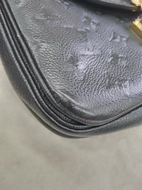 Sold Louis Vuitton Pochette Métis Monogram Empreinte Leather Black