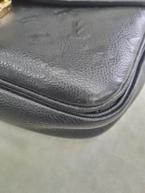 Sold Louis Vuitton Pochette Métis Monogram Empreinte Leather Black