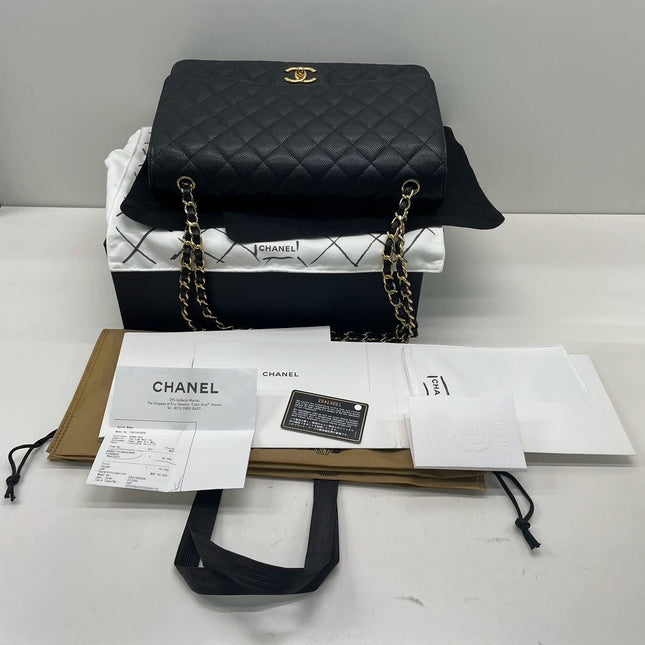 Sold Chanel Classic Flap Maxi Black Caviar Leather Double Flap with Gold Hardware, 2014-2015