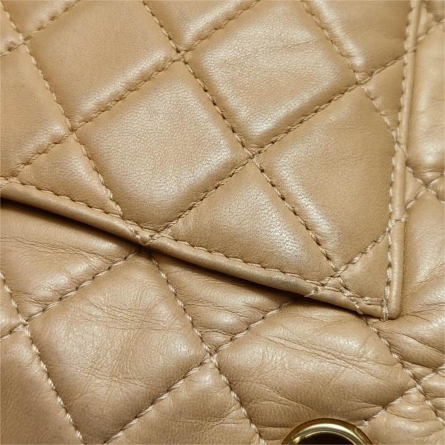 Chanel Classic Flap Maxi Beige Latte Lambskin Leather Giant Gold-tone CC Logo