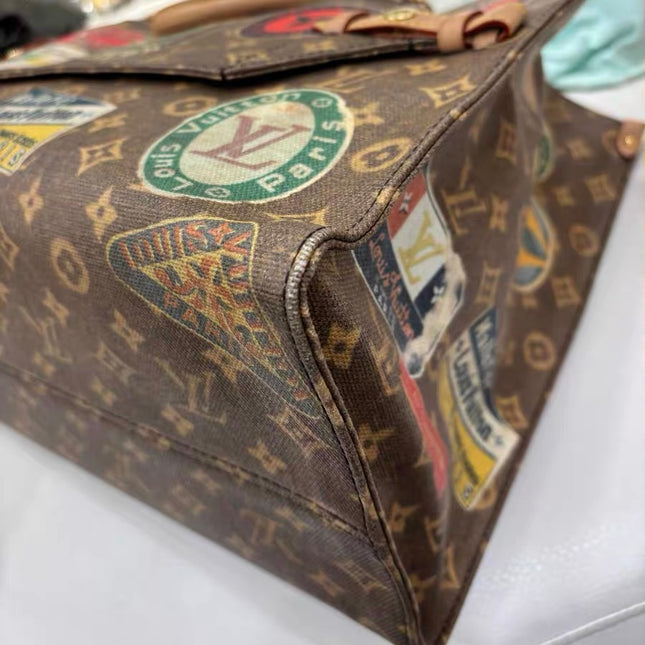 Sac cabas Louis Vuitton OnTheGo Large Hotel Labels Monogram Marron