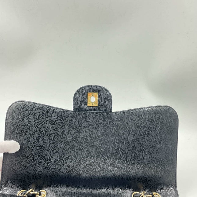Sold Chanel Classic Flap 2009 Jumbo Black Caviar Leather Single Flap with Gold Hardware