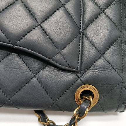 Chanel Classic Flap Medium Black Aged Calfskin Leather Braided Edge Gold Hardware