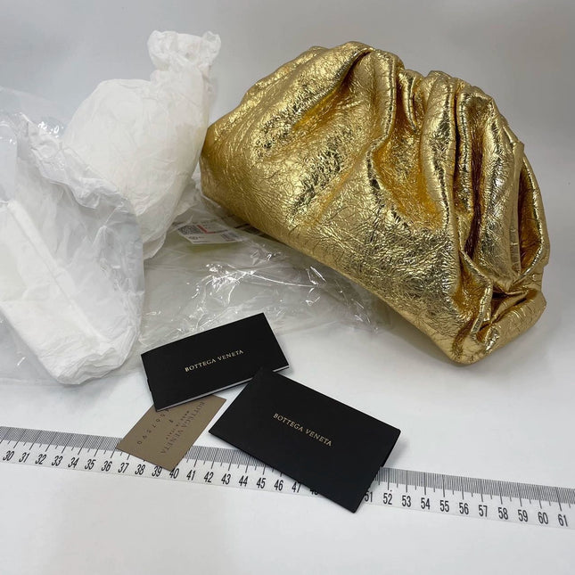 Sold Bottega Veneta Pouch Gold Leather