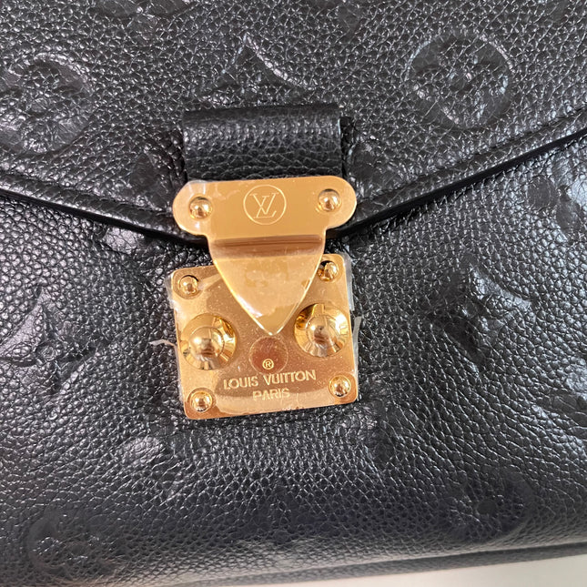 Sold Louis Vuitton Pochette Métis Monogram Empreinte Leather Black