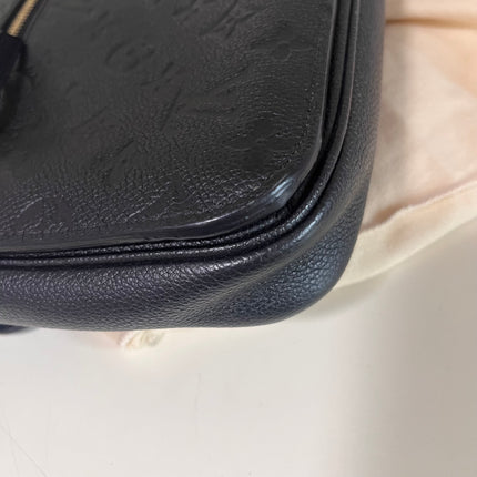 Sold Louis Vuitton Pochette Métis Monogram Empreinte Leather Black