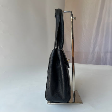 Sac Chanel Vintage Kelly à Rabat en Cuir Noir avec Bandoulière Réglable et Bijouterie en Or 24 carats