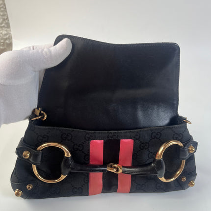 Sac bandoulière clouté en cuir de serpent noir et doré Gucci Horsebit 1955 Small