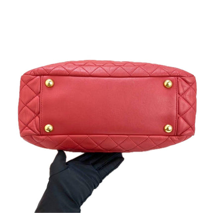 Sac cabas Chanel Grand Shopping Tote en cuir caviar bordeaux, taille GM, finitions argentées