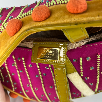 Sold Limited Edition John Galliano era Dior Saddle bag with pompom and bead