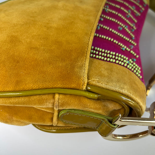 Sold Limited Edition John Galliano era Dior Saddle bag with pompom and bead