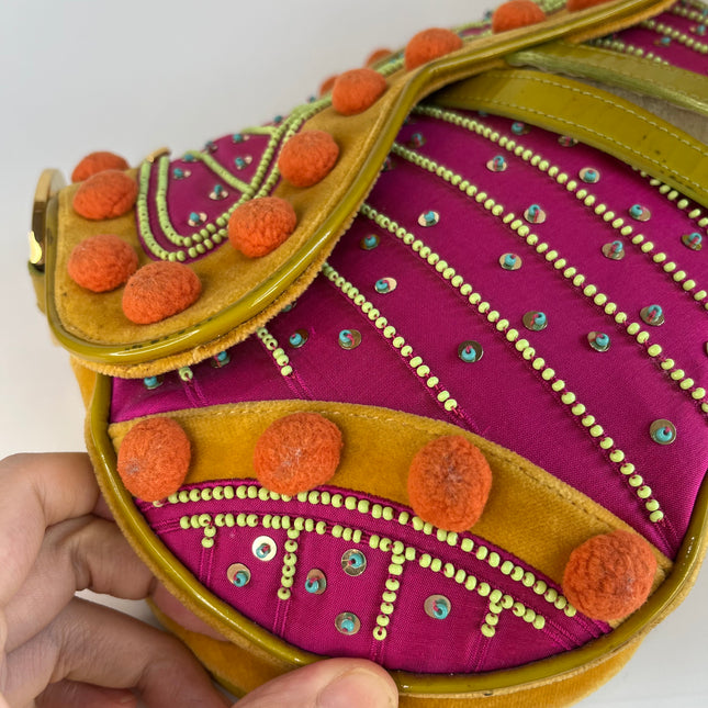 Sold Limited Edition John Galliano era Dior Saddle bag with pompom and bead