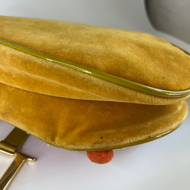 Sold Limited Edition John Galliano era Dior Saddle bag with pompom and bead