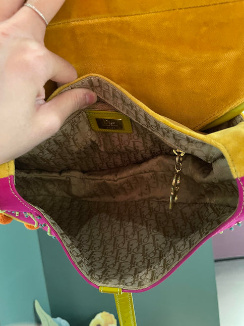 Sold Limited Edition John Galliano era Dior Saddle bag with pompom and bead