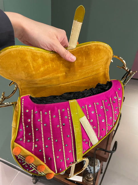 Sold Limited Edition John Galliano era Dior Saddle bag with pompom and bead