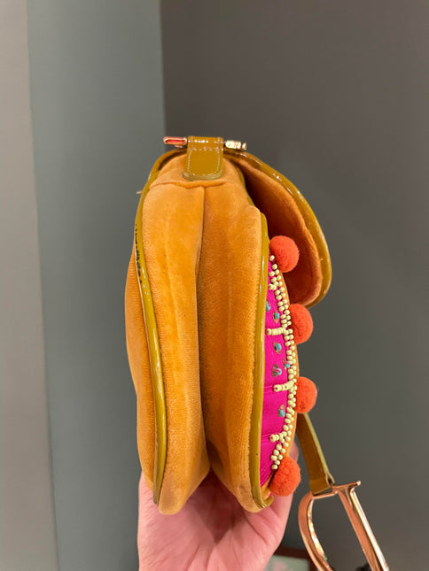Sold Limited Edition John Galliano era Dior Saddle bag with pompom and bead