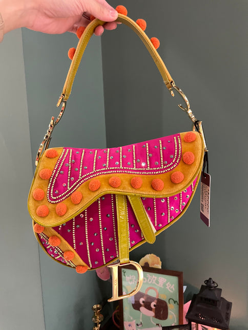 Sold Limited Edition John Galliano era Dior Saddle bag with pompom and bead