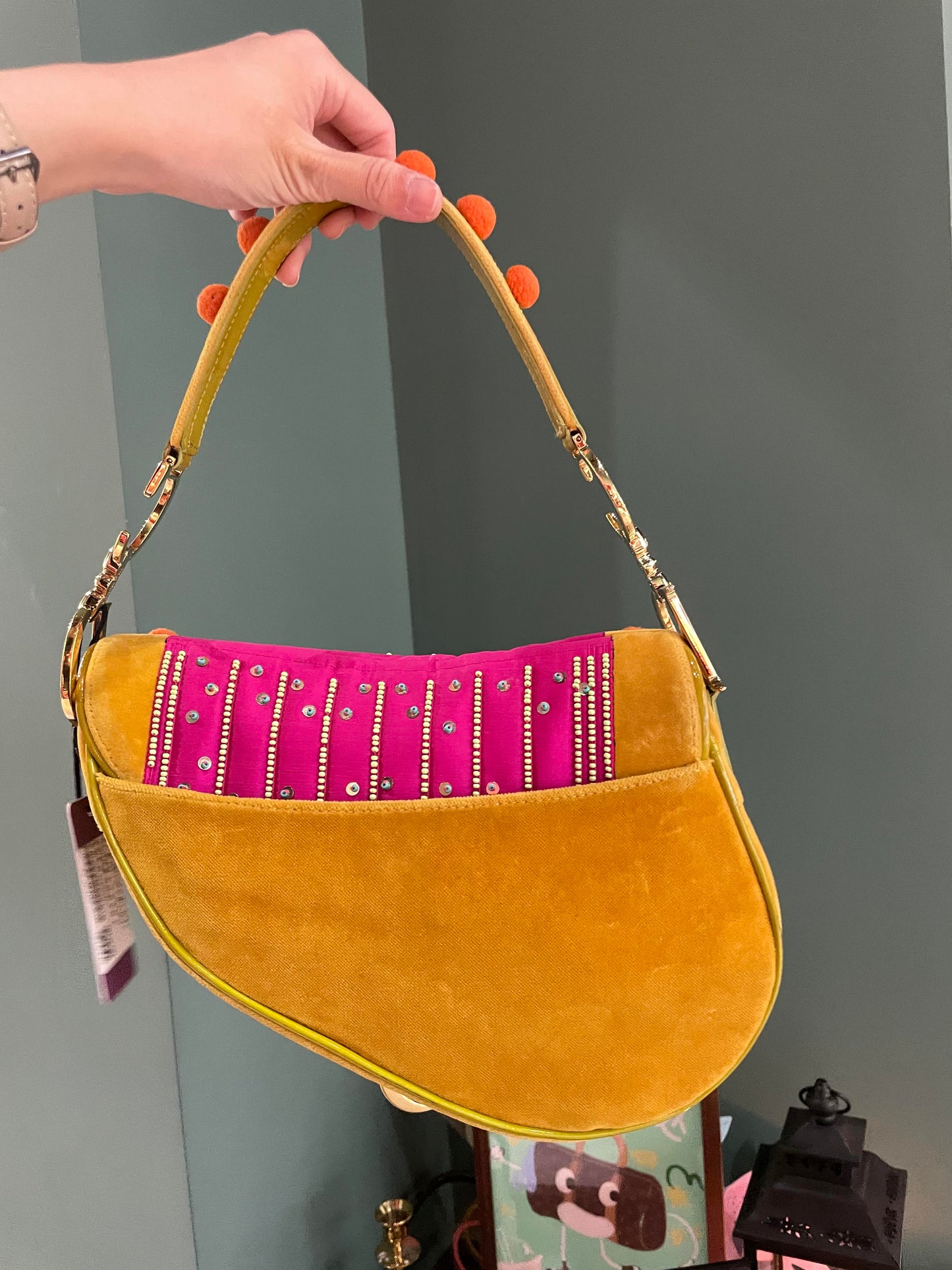 Sold Limited Edition John Galliano era Dior Saddle bag with pompom and bead