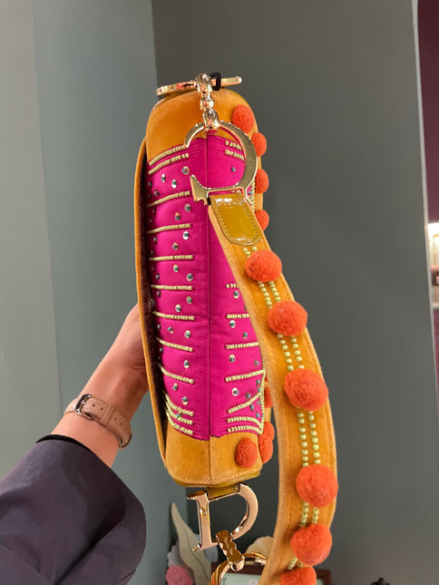 Sold Limited Edition John Galliano era Dior Saddle bag with pompom and bead